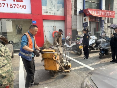 九江市城管局：稳步推进人行道停车泊位施划工作