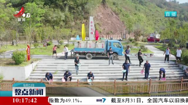 武宁县在修河开展增殖放流活动