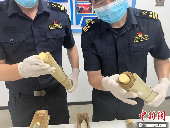 天津邮局海关查获象牙画轴轴头-中新网